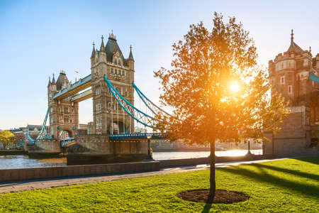 The London Tower bridge at sunrise on a sunny summer day - shot against blue clear sky into the shining sunのeditorial素材