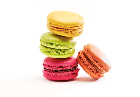 Fresh bright colored Macarons, or macaroons isolated on white backgroundの写真素材