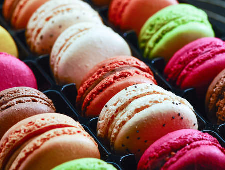 Fresh bright colored Macarons, or macaroons ready to eat at patisserieの写真素材