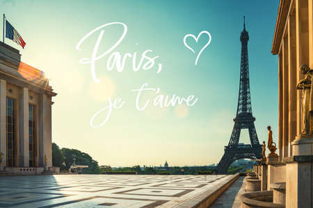 paris street with view on the famous paris eiffel tower on a sunny day with some sunshineの写真素材