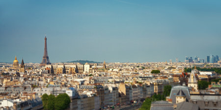 small paris street with view on the famous paris eiffel tower on a sunny day with some sunshine
