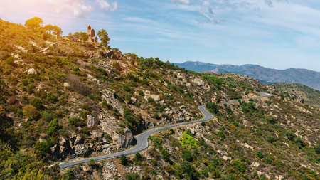 Mediterranean sea coast road into mountains horizon in summer with beautiful bright sun rays - wide angle panorama shotの写真素材