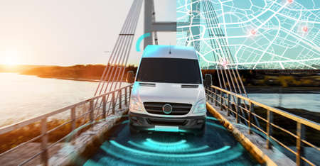 Autonomous Electric car driving on a highway with technology assistant tracking information, showing details. Visual effects conceptの写真素材