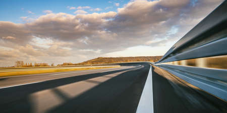 Race Car / motorcycle racetrack after rain on a sunny day. Fast motion blur effect. Ready to raceの写真素材