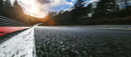 Race Car / motorcycle racetrack after rain on a cloudy mixed weather day. Ready to raceの写真素材