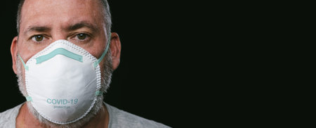 Old man wearing an anti virus protection mask to prevent others from corona COVID-19 and SARS cov 2...