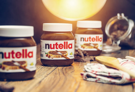 AACHEN, GERMANY - JAN 07, 2021: Pot of Nutella, the popular brand name of a sweetened hazelnut cocoa spread, introduced to the market in 1964 by Italian company Ferrero who celebrates 75 years anniversary in 2021のeditorial素材
