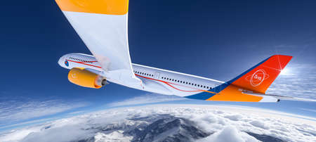 Commercial modern passenger airliner airplane flying in the sky above the mountainsの写真素材