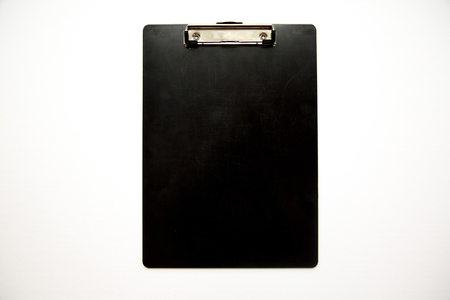 Clipboard on white background shot overhead.の写真素材