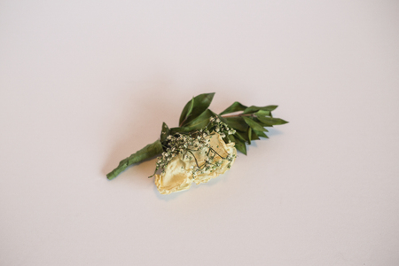 Rose boutonniere on white background.の写真素材