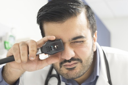Doctor examining a patient's eyes.の写真素材