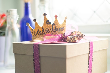 Birthday present with birthday princess crown indoorsの写真素材