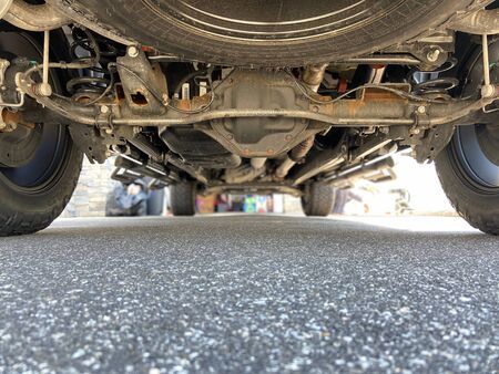 Undercarriage of a truck on a sunny day.の写真素材