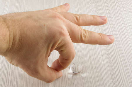 Playing with glass bubbleの写真素材