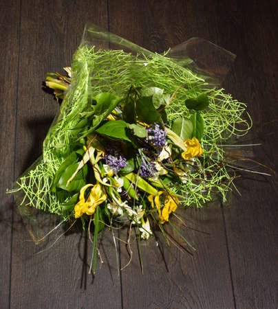 Bouquet of flowers lying on the floorの写真素材