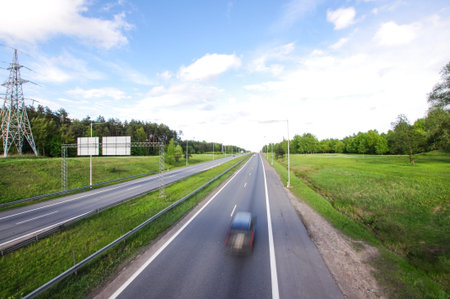 Empty road with one car motion blur