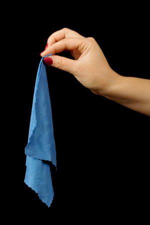 Female hand with manicure holding cleaning clothの写真素材