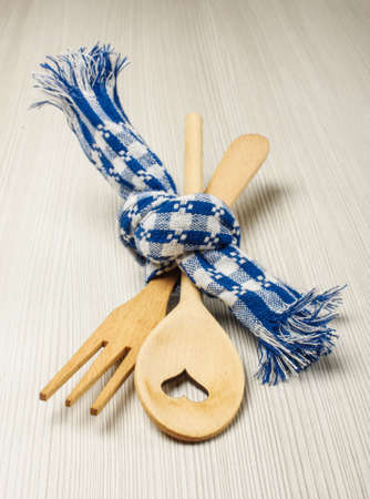 Wood fork and spoon tied with blue towel wedding conceptの写真素材