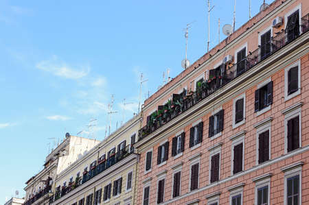 Many tv aerials on the public apartment in Rome Italyの写真素材