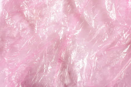 Pink wrinkled plastic bag texture abstractの写真素材