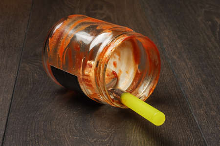 Empty ketchup jar on the floor low angleの写真素材