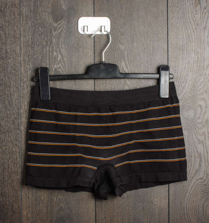 Black boy shorts on the hangerの写真素材