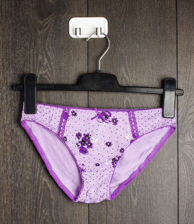 Violet color lingerie on the hangerの写真素材