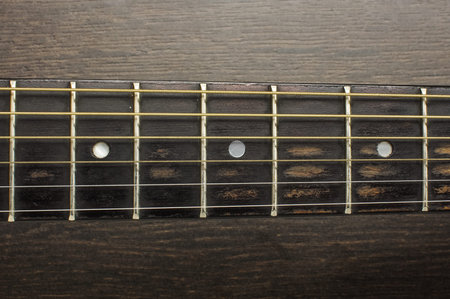 Acoustic guitar frets close up