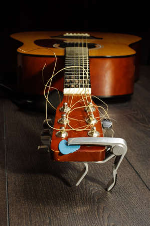 Low angle view of six strings acoustic guitarの写真素材