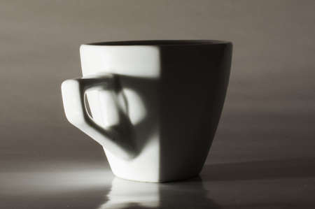 White coffee mug isolated on the grey backgroundの写真素材