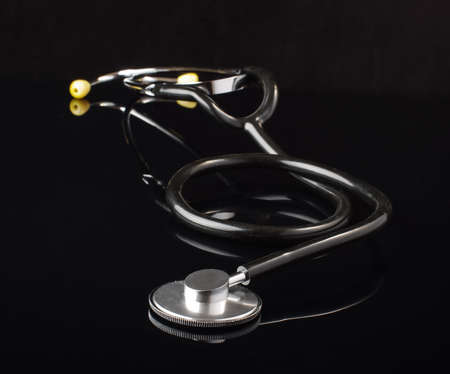 Stethoscope isolated on the black backgroundの写真素材