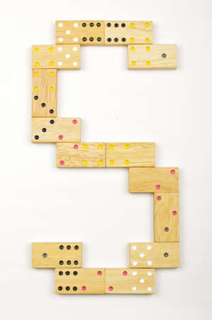 Alphabet letter S arranged from wood dominoes tiles isolatedの写真素材