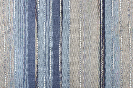 Abstract photography of blue fabric with grey stripes detail