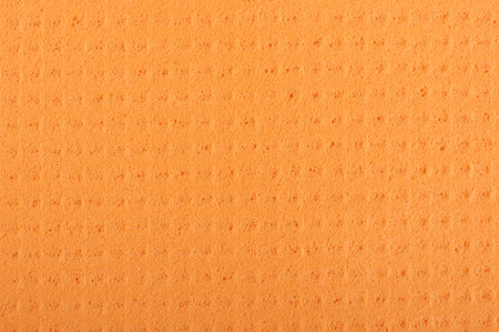 Orange cleaning cloth sponge surface patternの写真素材
