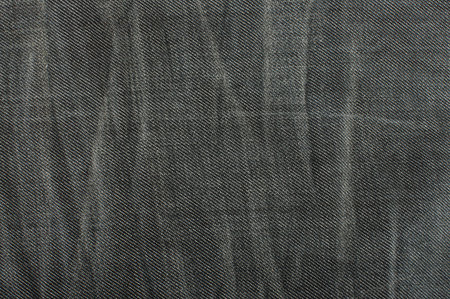 Dark grey jeans pattern with wrinkles