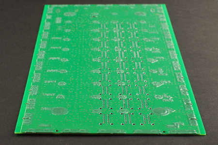 Printed circuit board with green solder mask isolated on the black background
