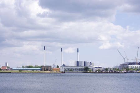 COPENHAGEN, DENMARK - JULY 21, 2015: Photo of industrial buildings in the harbour of Copenhagen. Photo taken on July 21th 2015.のeditorial素材
