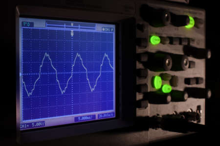 Oscilloscope at night concept with deep shadowsの写真素材