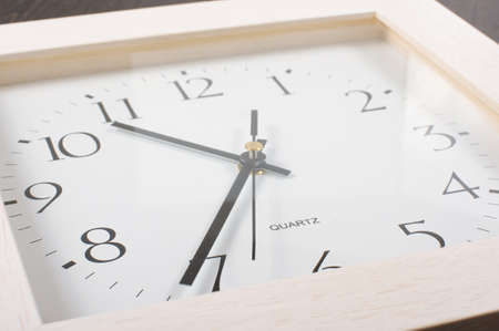 Square shape office clock low angle close upの写真素材