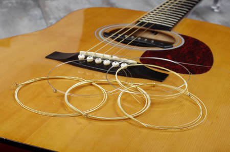 Guitar strings on the acoustic guitarの写真素材