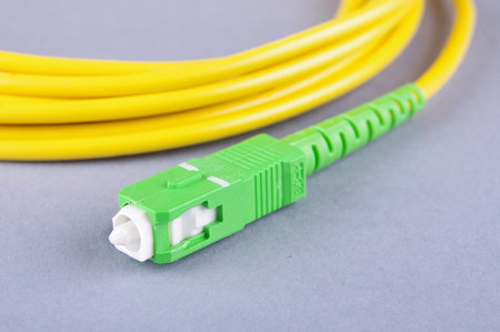 Fiber optics SC connector isolated on the gray background