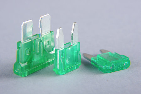 Blade type car electrical fuses isolated on the gray backgroundの写真素材