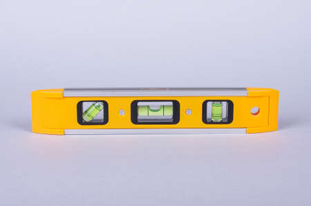 Spirit level tool isolated on gray backgroundの写真素材