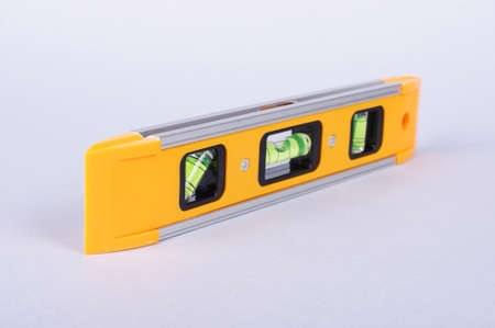 Spirit level tool isolated on gray backgroundの写真素材