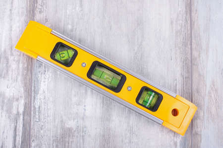 Spirit level tool isolated on reclaimed wood backgroundの写真素材