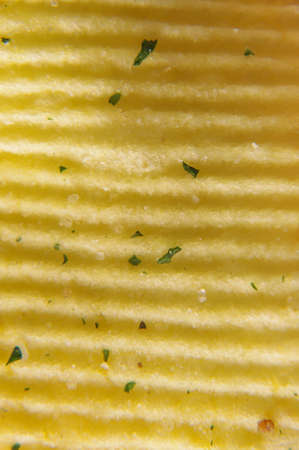 Wavy potato chips abstract texture pattern macro close upの写真素材