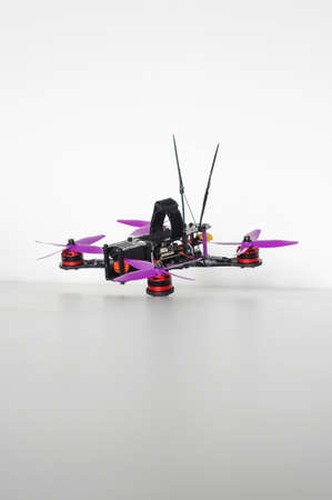 Racing quadcopter isolated on the white backgroundの写真素材