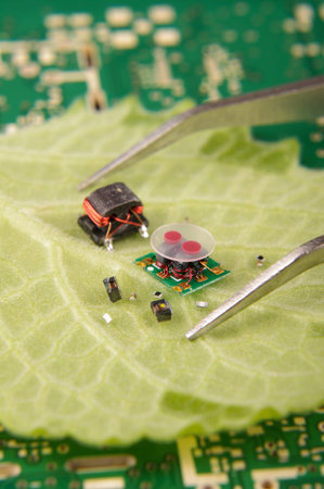 High integration electronics concept electronic components in comparison to plant leaf size