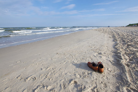 Businessman shoes left on the beach. Holidays concept