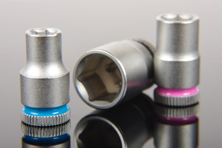 Replaceable socket wrench heads isolated on the black reflective backgroundの写真素材